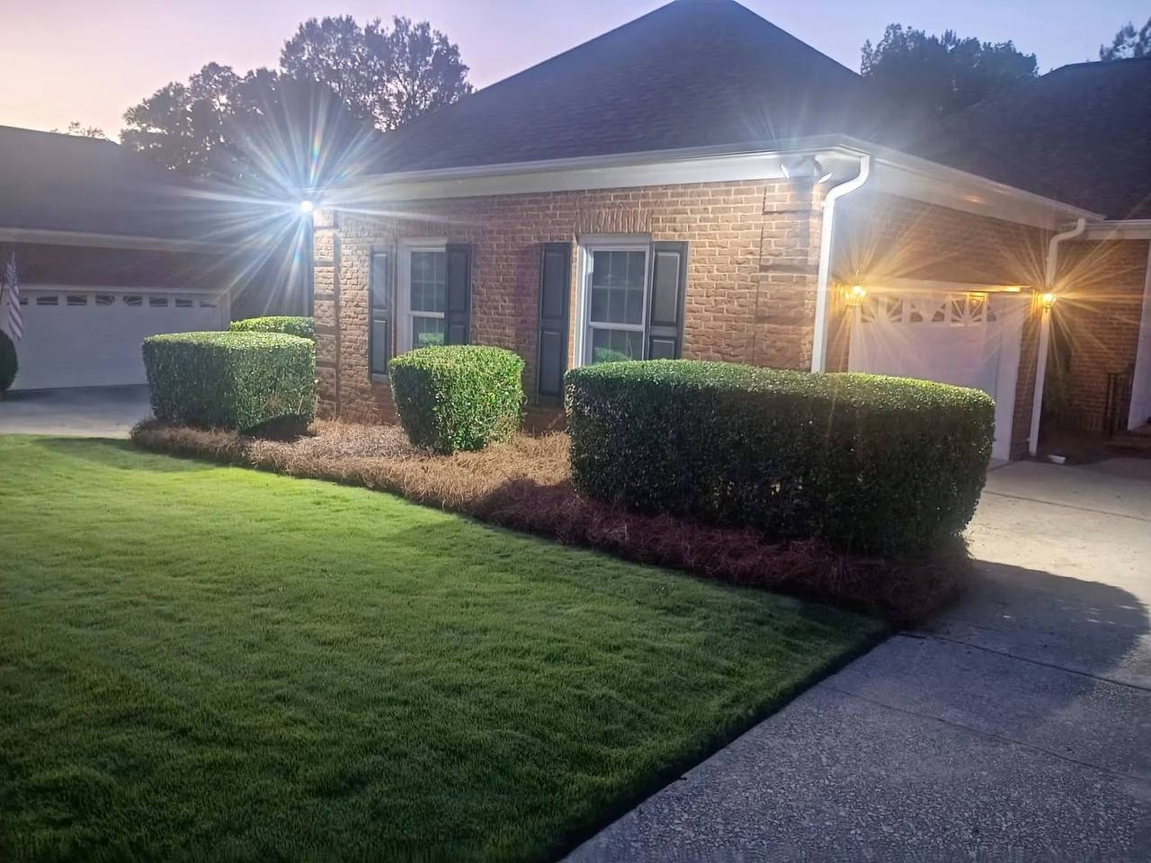 Freshly trimmed hedges and mulched beds at dusk, Columbia SC