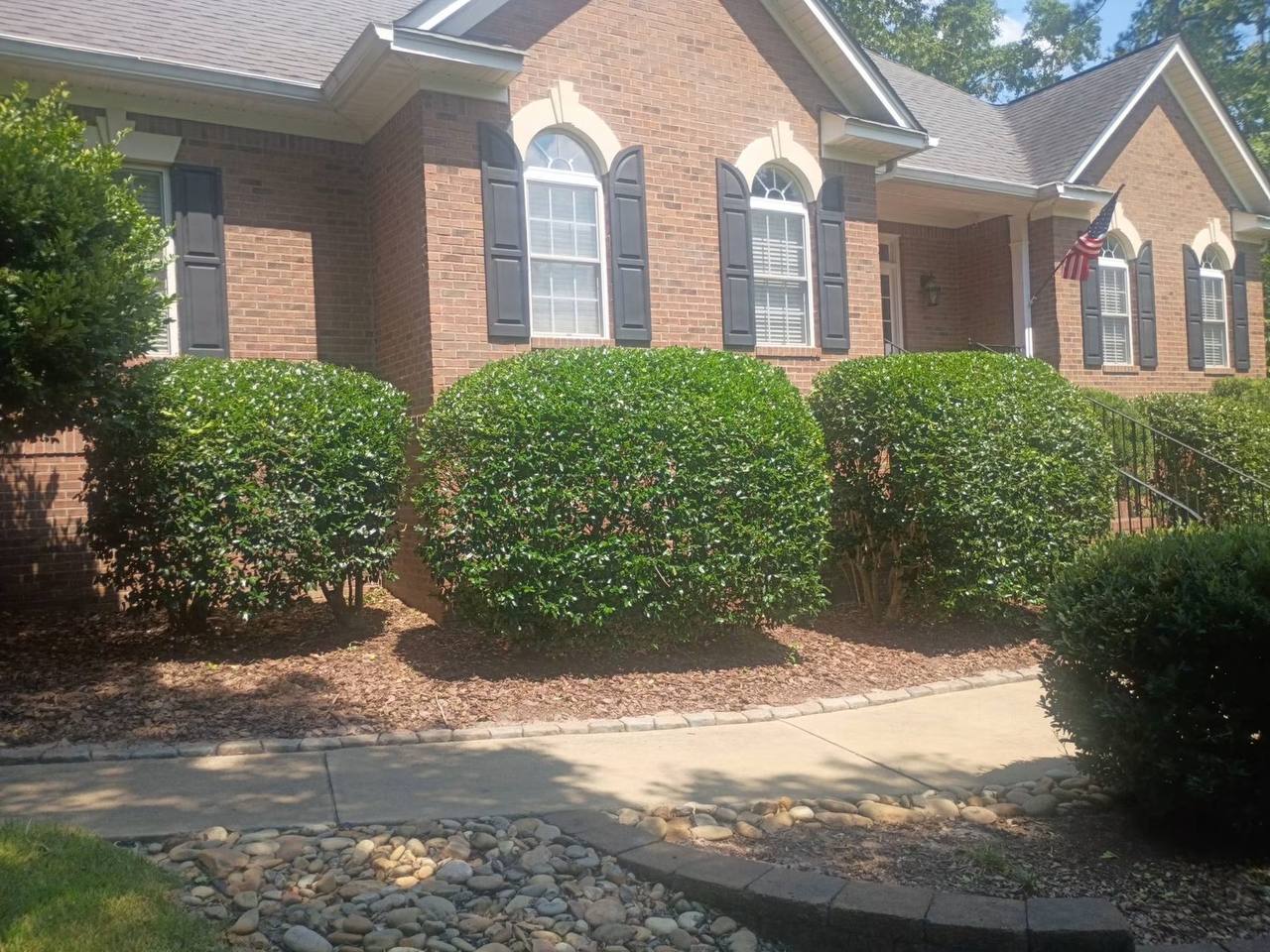 River rock drainage bed with fresh mulch